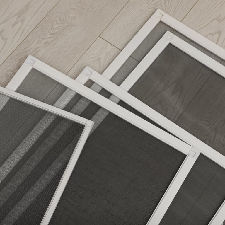 Set of window screens on wooden floor, closeup